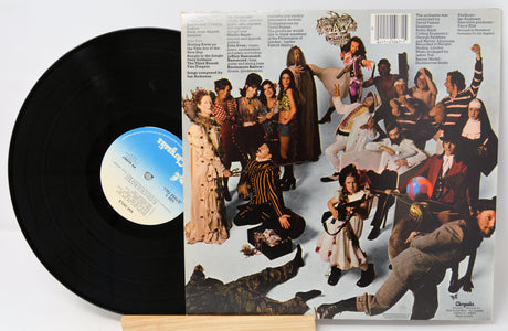 Vinyl record with a colorful cover featuring people in various poses.