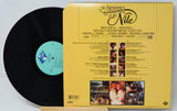 Vinyl record with yellow cover featuring text and images on a light gray background