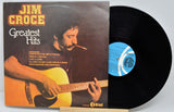 Vinyl record with cover featuring Jim Croce and text 'Greatest Hits' on a white background