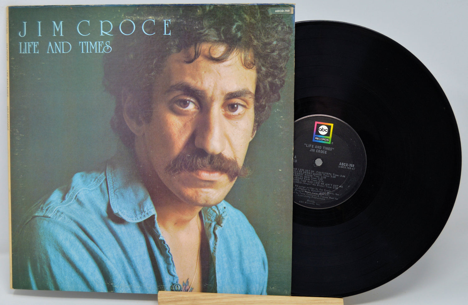 Vinyl record with cover featuring a man's face and 'Jim Croce Life and Times' text.