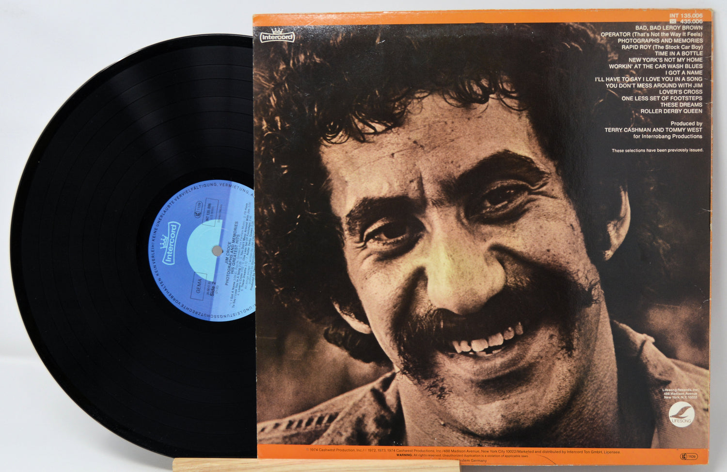 Vinyl record with a smiling man on the cover