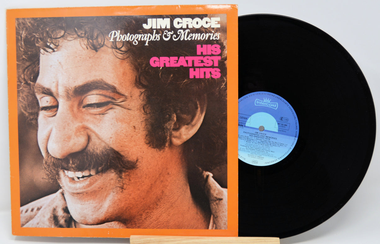 Vinyl record with cover featuring a smiling man's face, titled 'His Greatest Hits' by Jim Croce.