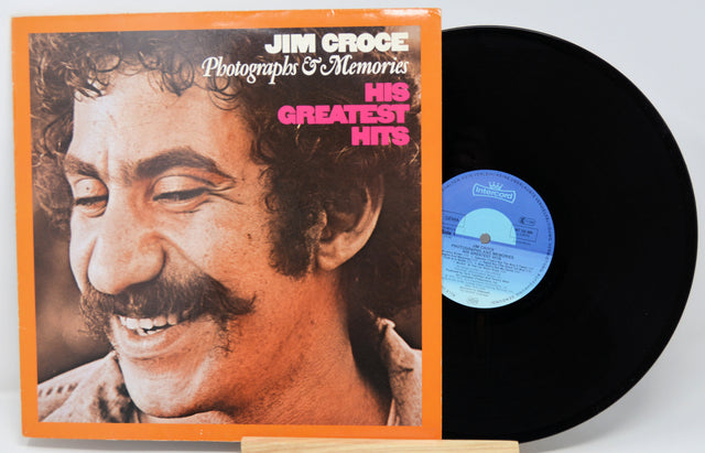Vinyl record with cover featuring a smiling man's face, titled 'His Greatest Hits' by Jim Croce.