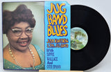 A vinyl record album titled 'Jug Band Blues' by Jam Kweskin & The Jug Band, shown with the printed cover sleeve and a black record partially pulled out. The cover features a portrait of a smiling woman on the left and a bright blue center panel with yellow and white title text.