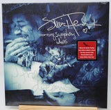 Signed Elvis Presley 'Morning Symphony Ideas' limited edition yellow vinyl LP album cover, autographed with a white marker signature and heart, displayed on a wooden stand.