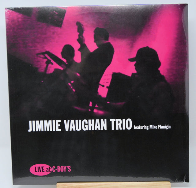 Album cover of Jimmie Vaughan Trio featuring Mike Flannigan with silhouettes against a pink light.