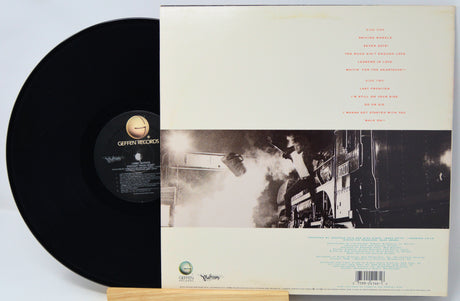 Jeffrey Garcia 'Music From The Dream' vinyl record LP shown with the black record partially pulled from the back cover, photographed on a light gray background.