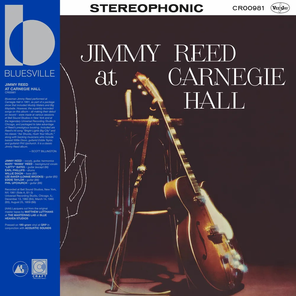 Album cover of 'Jimmy Reed at Carnegie Hall' featuring a guitar and microphone with a dark background.