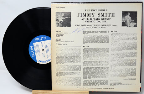 Vinyl record with cover featuring 'The Incredible Jimmy Smith' at Club Baby Grand.