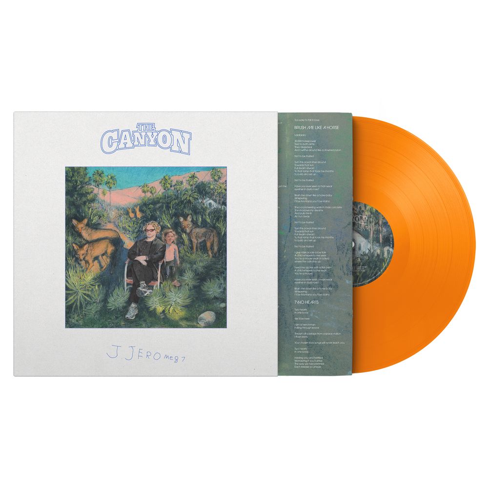 Vinyl record with orange disc and white cover featuring artwork and text.