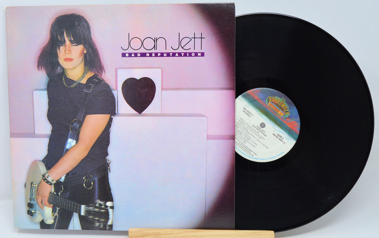Vinyl record with colorful cover featuring text 'Land of 1,000 Dances?!!?' and a record label.