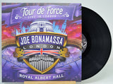 Joe Bonamassa 'Tour de Force Live in London' vinyl record album with the cover art in front and the black LP record partially visible behind it on a light background.