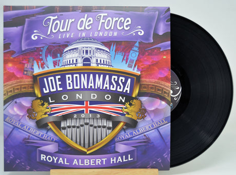 Joe Bonamassa 'Tour de Force Live in London' vinyl record album with the cover art in front and the black LP record partially visible behind it on a light background.