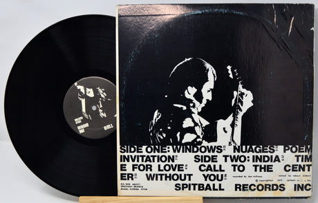 Vinyl record with cover featuring a black and white image of a couple and text.