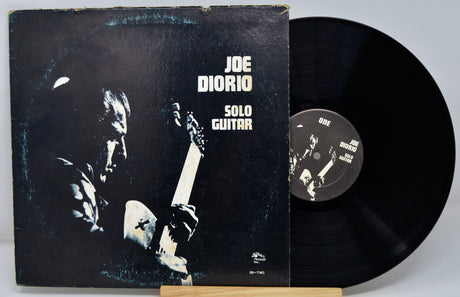 Front cover and record of Joe Diorio Solo Guitar vinyl LP with artist's name and guitar illustration