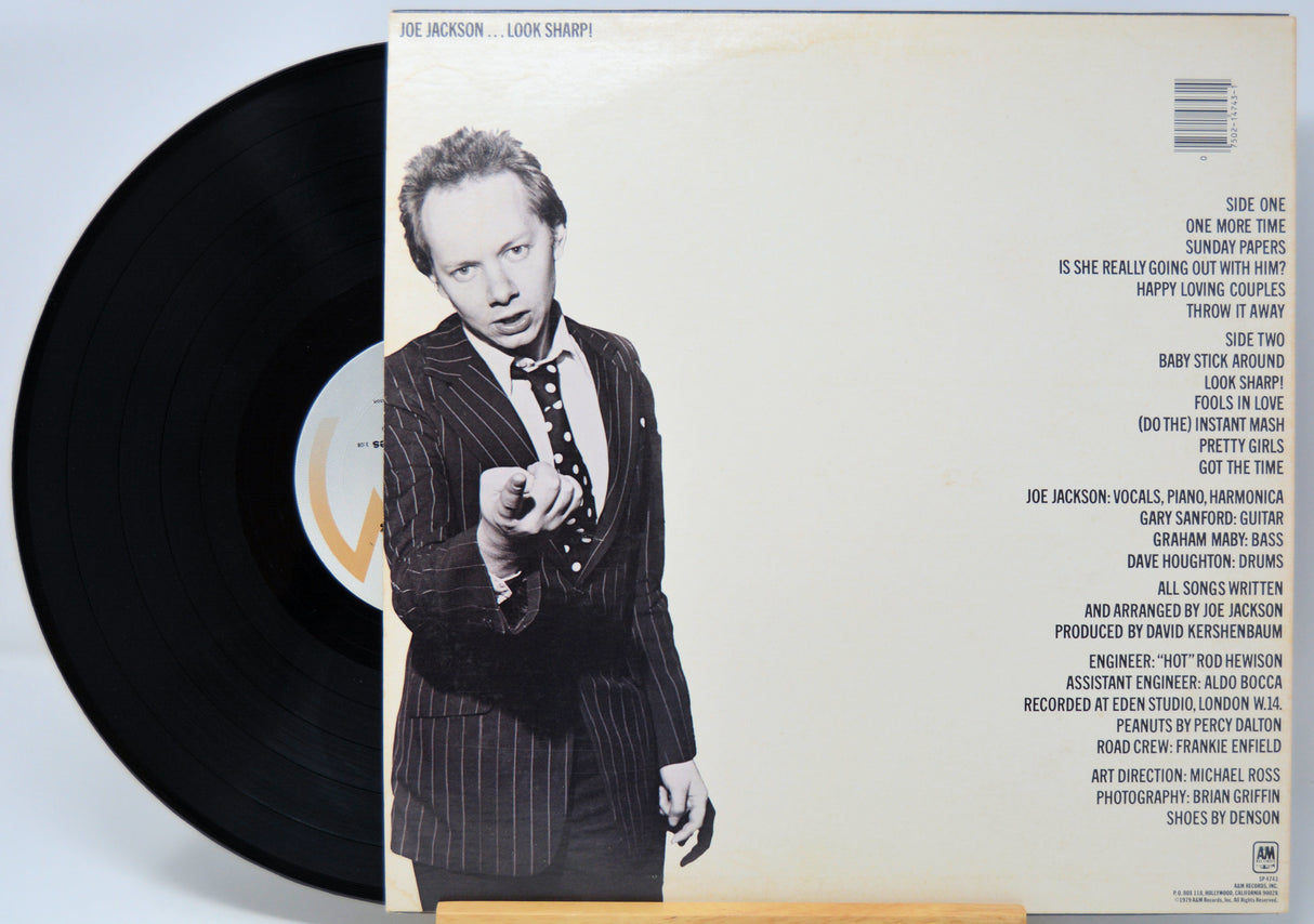 'Joe Jackson Look Sharp' Vinyl record with a cover featuring a person in a suit and text