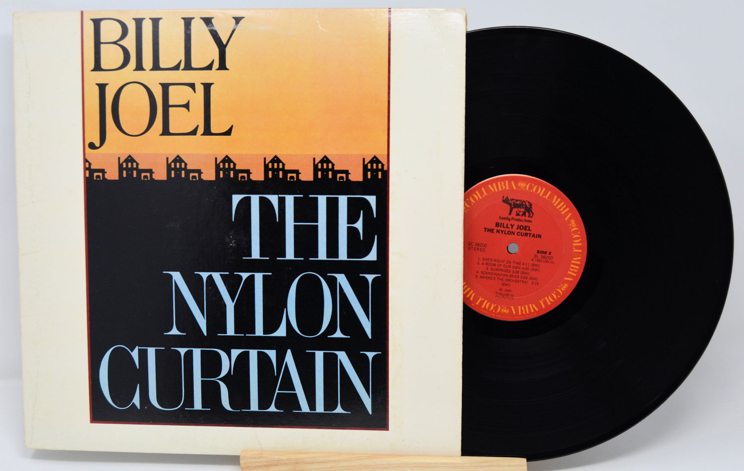 Vinyl record and cover for 'The Nylon Curtain' by Billy Joel on a white background