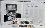 An open gatefold cover showing a black-and-white portrait of Coltrane on the left page and an article titled 'COLTRANE "LIVE" at the Village Vanguard' on the right page, with a printed program or booklet placed in front.