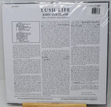 Back cover of a vinyl record sleeve for John Coltrane's 'Lush Life' (Vols. 1-4, and Quintet), sealed in plastic shrink wrap, photographed against a white background.