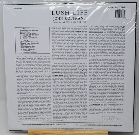 Back cover of a vinyl record sleeve for John Coltrane's 'Lush Life' (Vols. 1-4, and Quintet), sealed in plastic shrink wrap, photographed against a white background.