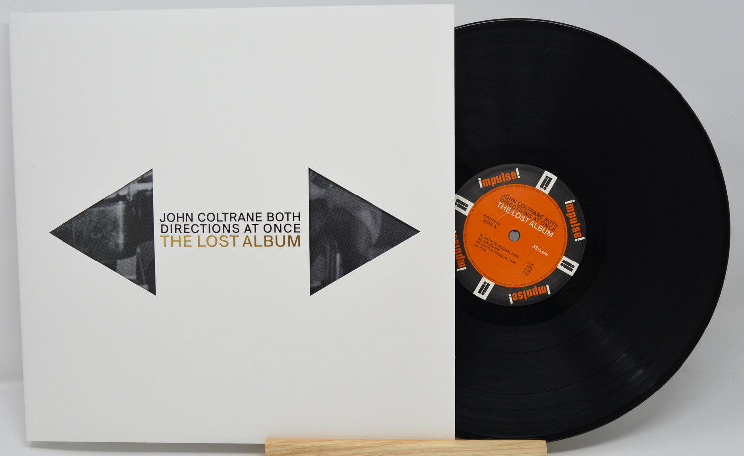 Front cover and vinyl record of John Coltrane Both Directions At Once The Lost Album with title