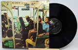 Vinyl record album 'No Dancin'' by John Lee Hooker, showing the illustrated cover on the left and the black LP record on the right against a light gray background.