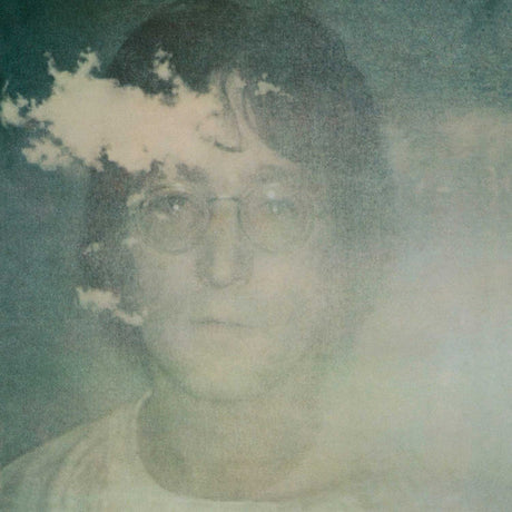Album cover of John Lennon's album 'Imagine' featuring a photograph of John Lennon with a smoky background.