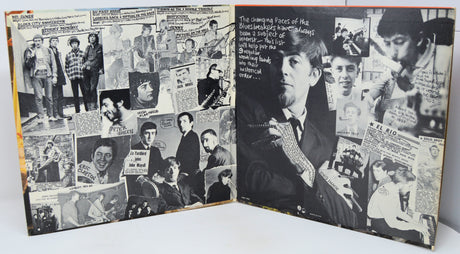 Vinyl record with cover featuring a person, on a light gray background