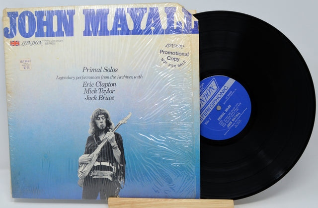 Vinyl record with John Mayall cover featuring a guitar player and text.