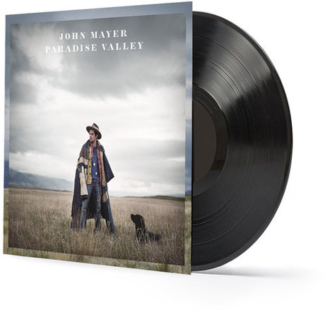Vinyl record with 'Paradise Valley' album cover featuring a person in a field with a dog.