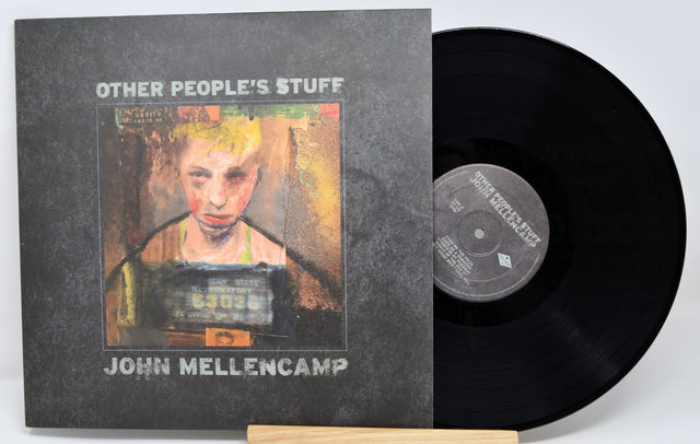 Front cover of John Mellencamp's 'Other People's Stuff' vinyl LP with painted mugshot artwork