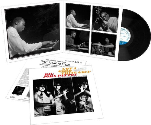 Vinyl record with a gatefold cover featuring black and white photos of musicians and text.