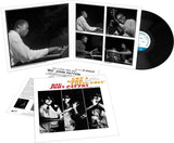 Vinyl record with a gatefold cover featuring black and white photos of musicians and text.