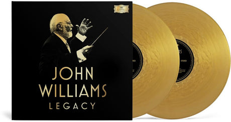 Black vinyl record album cover for John Williams 'Legacy' with two gold records partially visible behind it on a white background.
