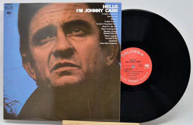 Vinyl record album 'I'm Johnny Cash' with the black record partially pulled from the sleeve, showing the cover portrait and Columbia Records label.
