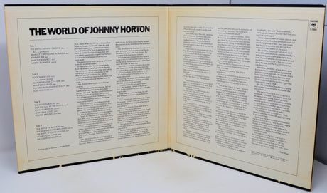 Open book titled 'The World of Johnny Horton' on a white background