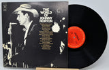 Vinyl record with cover featuring a cowboy and text, on a light gray background