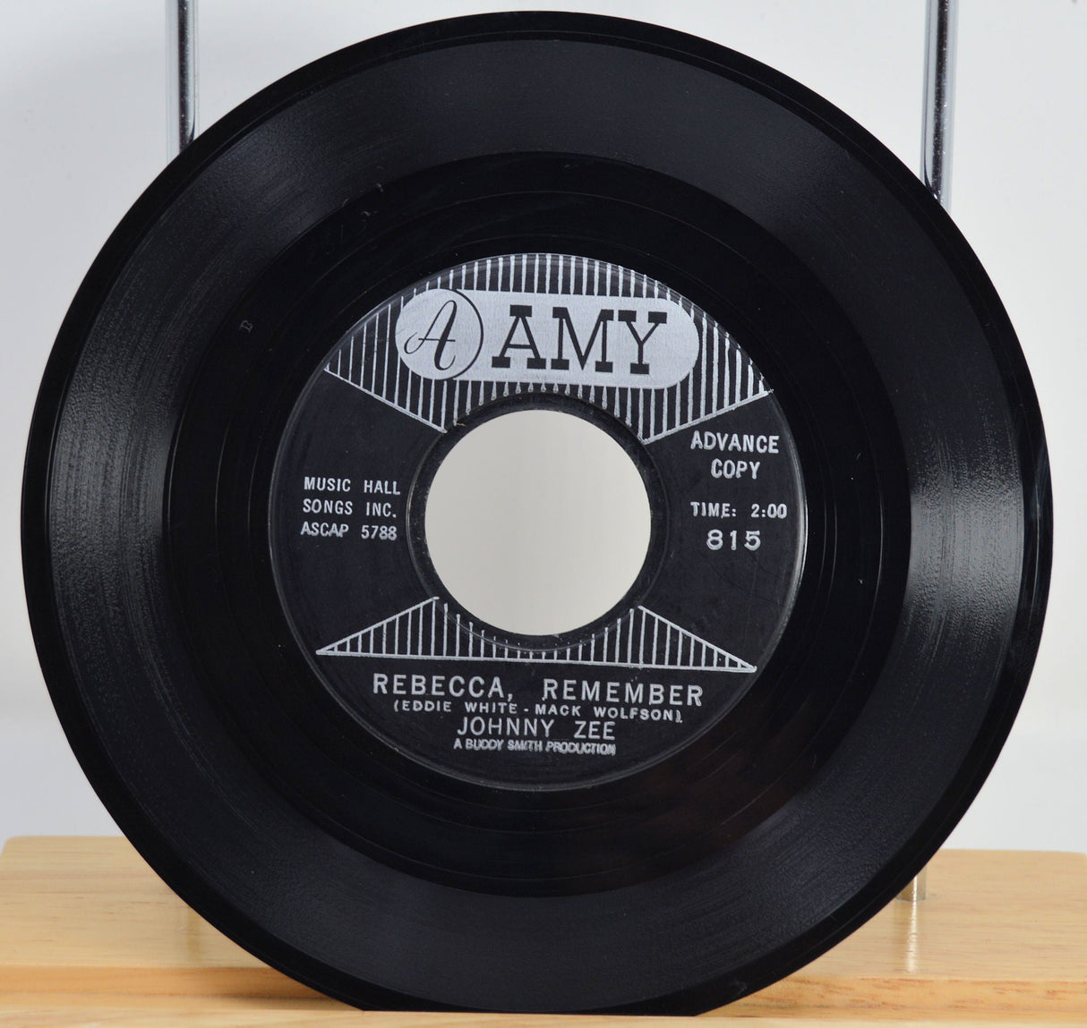 Vintage 45 RPM vinyl record of Johnny Zee's 'Rebecca, Remember' on the Amy label, advance copy