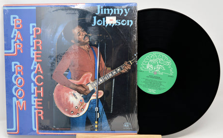 Vinyl record with cover featuring a musician and text 'Bar Room Preacher' by Jimmy Johnson.