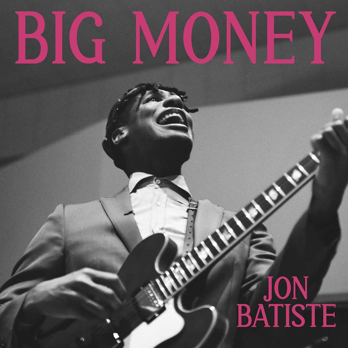 Black and white photo of Jon Batiste passionately playing guitar under 'BIG MONEY' album title