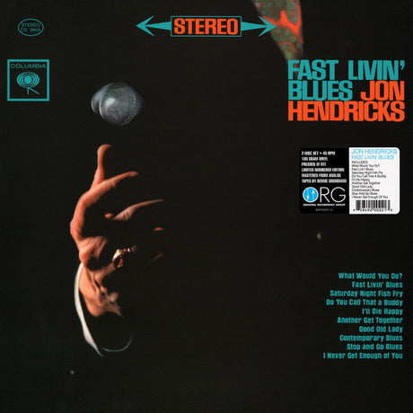 Vinyl record cover with a hand holding a microphone and text on a dark background.