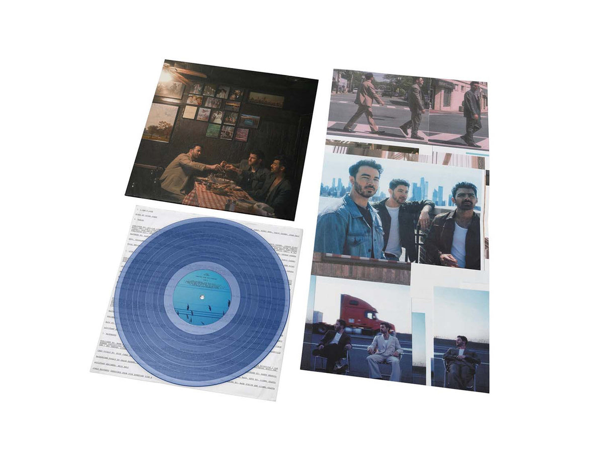 Blue vinyl record with photo sleeves featuring people in various settings