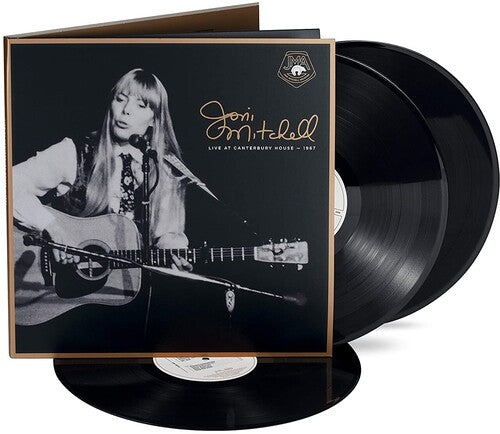 Vinyl record set with cover featuring a black and white photo of a musician playing guitar.