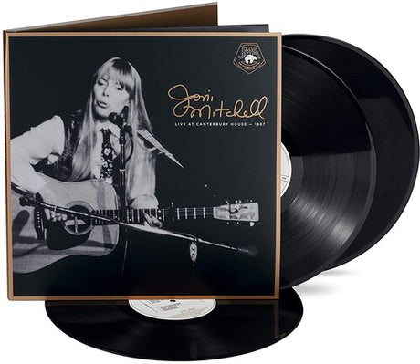 Vinyl record set with cover featuring a black and white photo of a musician playing guitar.