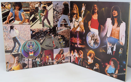 A vintage music album or photo collage book shown open, featuring multiple concert photographs of rock bands on the pages, with a circular multicolor jewel case or insert visible on the left side.