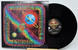 Coqui Munch 'Departure' vinyl record LP with its illustrated album cover sleeve and the black vinyl record partially pulled out, photographed on a white background.
