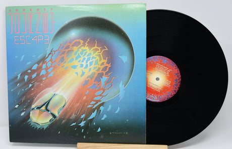 Vinyl record with a colorful cover featuring abstract designs.