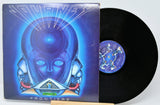 Vinyl record with cover featuring a robot design on a blue background