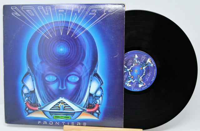 Vinyl record with cover featuring a robot design on a blue background