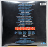 The back cover of the Journey vinyl record, sealed in plastic shrink-wrap. The cover is predominantly black with white and blue text listing the album's tracks, a large red and orange 'JOURNEY' logo in the center, and a barcode in the top right corner.